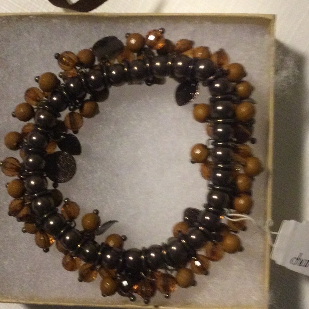 Woman’s Charming Charlie Stretch Bracelet color brown beads pretty and New